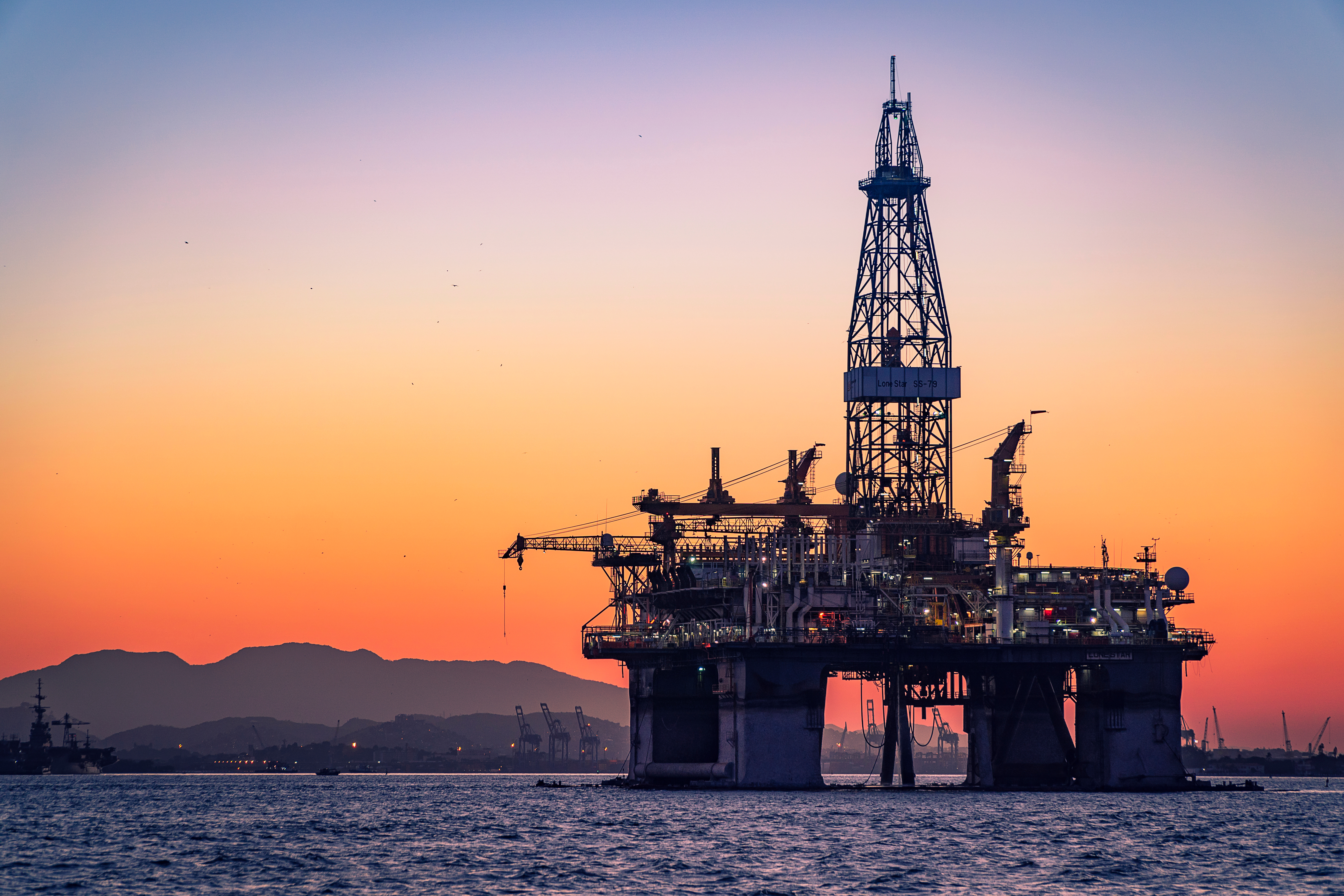 Offshore oil platform at sunset